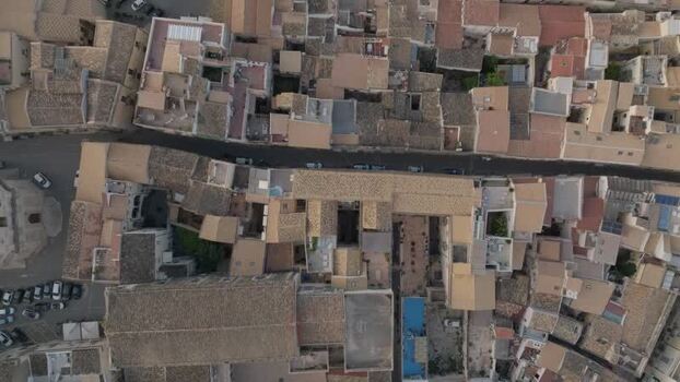 Aerial view of the historic Island of Ortigia rooftops Italy.