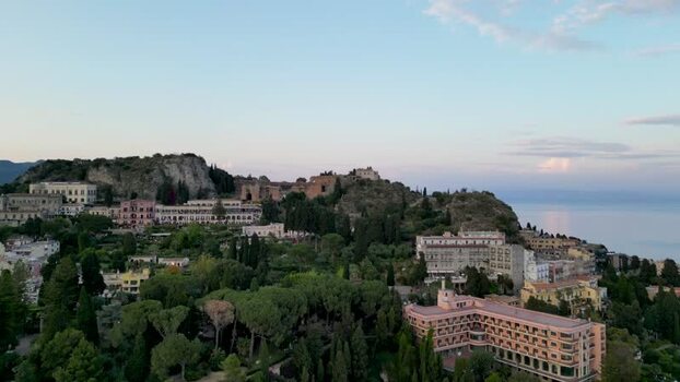 Aerial view of historic buildings and lush gardens in Taormina Italy. Aerial view of historic buildings and lush gardens in Taormina Italy.