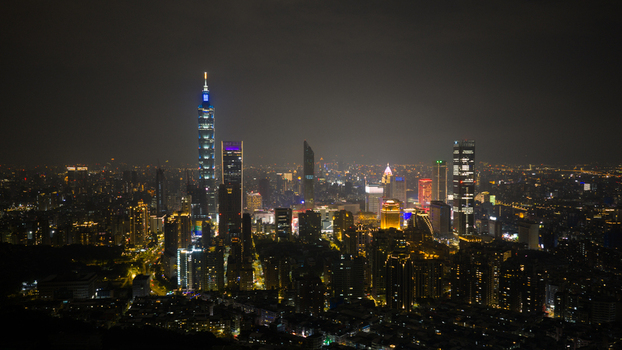 Taipei City Taiwan 20 February 2026 Aerial view of Taipei 101 illuminated at night amidst the dense urban skyline with glowing skyscrapers and city lights. Taipei City Taiwan 20 February 2026 Aerial view of Taipei 101 illuminated at night amidst the dense urban skyline with glowing skyscrapers and city lights.