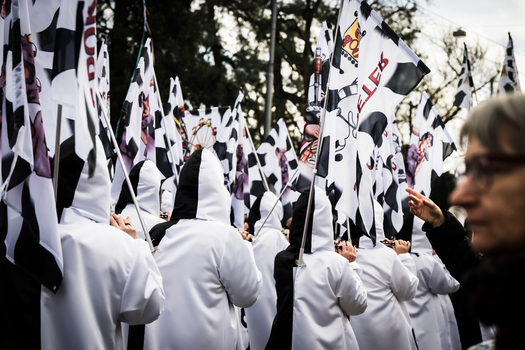 Basel Switzerland 10 March 2025 View of Fasnacht parade with monochrome costumes and striking flags creating a sea of black and white against the urban backdrop. Basel Switzerland 10 March 2025 View of Fasnacht parade with monochrome costumes and striking flags creating a sea of black and white against the urban backdrop.
