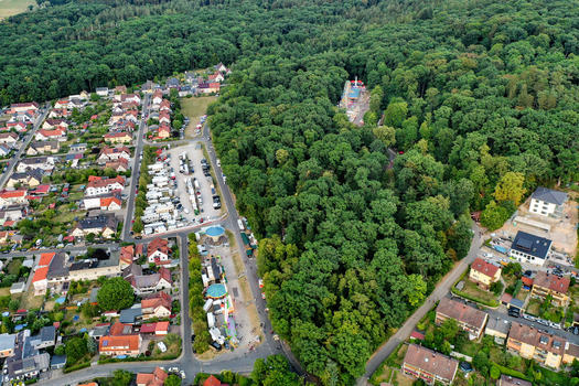 Forchheim Germany 26 July 2025 Aerial view of Annafest festival grounds with stalls and rides nestled between residential houses and a dense green forest. Forchheim Germany 26 July 2025 Aerial view of Annafest festival grounds with stalls and rides nestled between residential houses and a dense green forest.