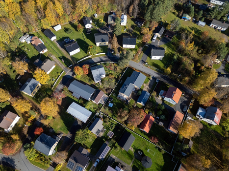 Aerial view of the Takalaanila residential area featuring detached houses lush autumn trees with yellow and green foliage and winding roads in Oulu North Ostrobothnia Finland. Aerial view of the Takalaanila residential area featuring detached houses lush autumn trees with yellow and green foliage and winding roads in Oulu North Ostrobothnia Finland.