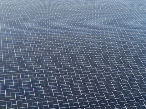 Aerial view of a large solar farm with rows of photovoltaic panels in Poland. Aerial view of a large solar farm with rows of photovoltaic panels in Poland.