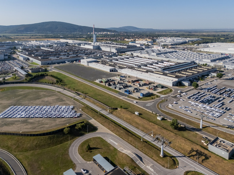 Aerial view of the Volkswagen Slovakia factory in Devinska Nova Ves featuring industrial halls and parking lots with new cars Bratislava Bratislavsky kraj Slovakia. Aerial view of the Volkswagen Slovakia factory in Devinska Nova Ves featuring industrial halls and parking lots with new cars Bratislava Bratislavsky kraj Slovakia.