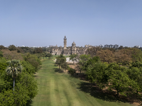 Vadodara India 14 March 2026 Aerial view of the Laxmi Vilas Palace with its ornate Indo Saracenic architecture sprawling green lawns and dense trees under a clear blue sky. Vadodara India 14 March 2026 Aerial view of the Laxmi Vilas Palace with its ornate Indo Saracenic architecture sprawling green lawns and dense trees under a clear blue sky.