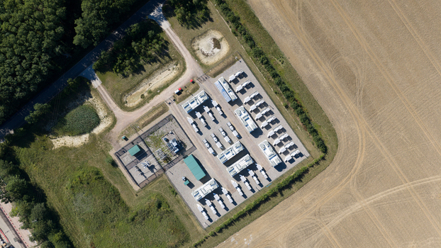 Aerial view of Pelham Storage Limited featuring rows of storage units and containers situated within a rural landscape near fields and woodland in Bishop s Stortford England United Kingdom. Aerial view of Pelham Storage Limited featuring rows of storage units and containers situated within a rural landscape near fields and woodland in Bishop s Stortford England United Kingdom.