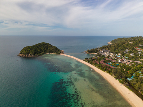 Aerial view of Ko Pha Ngan with its sandy beach turquoise waters and lush tropical greenery in Ko Pha ngan District Surat Thani Thailand.