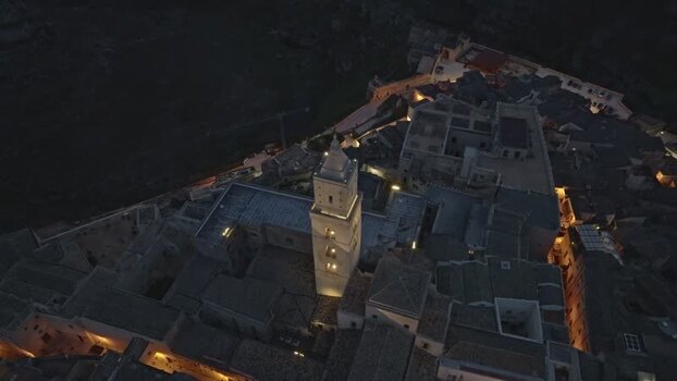 Aerial view of Matera Cathedral at night in Italy.