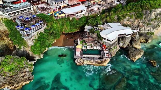 Aerial view of a cliffside beach club in Bali Indonesia.