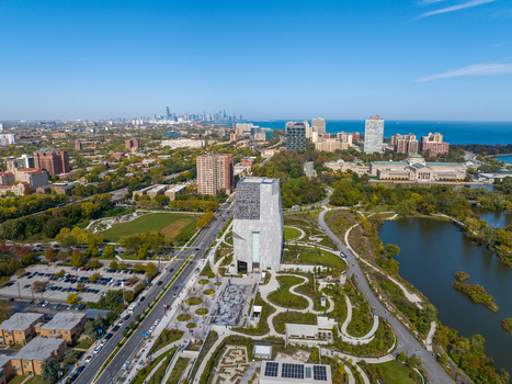Aerial view of The Obama Presidential Center surrounded by lush parkland winding paths and the Chicago skyline in the distance Chicago Illinois United States. Aerial view of The Obama Presidential Center surrounded by lush parkland winding paths and the Chicago skyline in the distance Chicago Illinois United States.