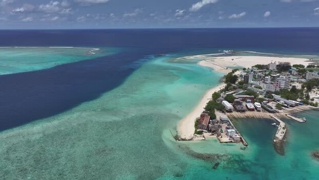 Aerial view of Gulhi island with turquoise lagoons in Maldives. Aerial view of Gulhi island with turquoise lagoons in Maldives.