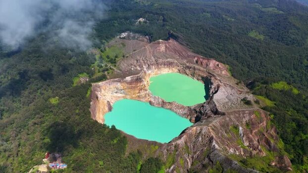 Aerial view of the volcanic crater lakes of Kelimutu Indonesia. Aerial view of the volcanic crater lakes of Kelimutu Indonesia.