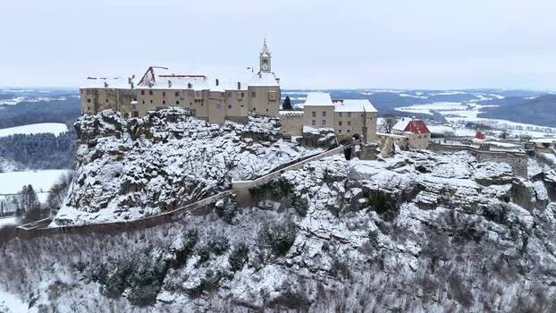 Aerial view of Riegersburg Castle on a snowy rock Austria.