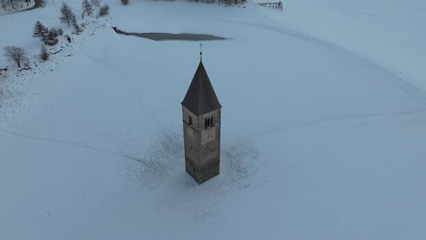 Aerial view of the historic Curon Bell Tower in Italy. Aerial view of the historic Curon Bell Tower in Italy.