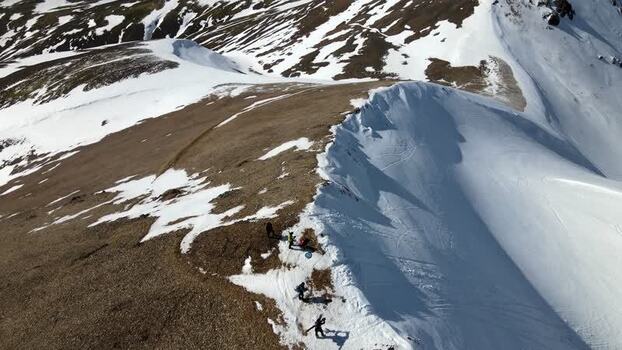 Aerial view of hikers on the snowy Moskardshnjukar Trail ridge Iceland Aerial view of hikers on the snowy Moskardshnjukar Trail ridge Iceland