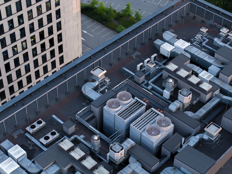 Aerial view of an AI data center cooling system with industrial fans and ventilation units on a rooftop in Krakow Lesser Poland Voivode Poland. Aerial view of an AI data center cooling system with industrial fans and ventilation units on a rooftop in Krakow Lesser Poland Voivode Poland.