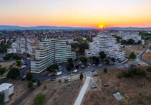Aerial view of Tapolca Y houses in Veszprem County Hungary with colorful panel apartment blocks Soviet era architecture and sunset light over the Balaton region. Aerial view of Tapolca Y houses in Veszprem County Hungary with colorful panel apartment blocks Soviet era architecture and sunset light over the Balaton region.
