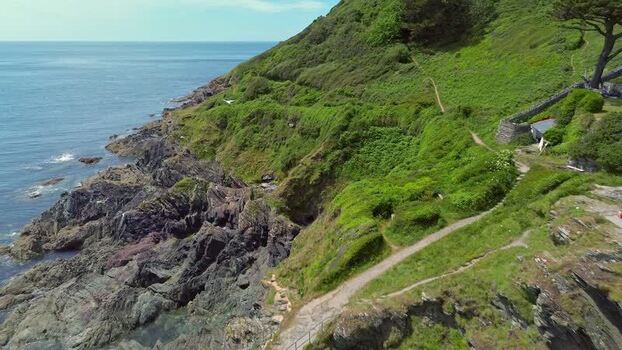 Aerial view of the rugged coastline in Polperro United Kingdom. Aerial view of the rugged coastline in Polperro United Kingdom.