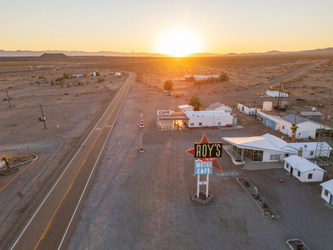 Amboy United States 06 April 2026 Aerial view of Roy s Motel and Cafe bathed in the warm glow of the setting sun a stark contrast to the arid desert landscape. Amboy United States 06 April 2026 Aerial view of Roy s Motel and Cafe bathed in the warm glow of the setting sun a stark contrast to the arid desert landscape.