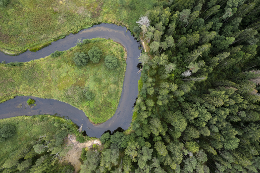 Aerial view of the winding river in Lahemaa National Park surrounded by lush green forests and meadows in Lahemaa Estonia. Aerial view of the winding river in Lahemaa National Park surrounded by lush green forests and meadows in Lahemaa Estonia.