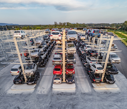 Livron sur Drome France 20 June 2026 Aerial view of an automated car storage facility with rows of vehicles stacked on multi level metal racks under a clear sky. Livron sur Drome France 20 June 2026 Aerial view of an automated car storage facility with rows of vehicles stacked on multi level metal racks under a clear sky.
