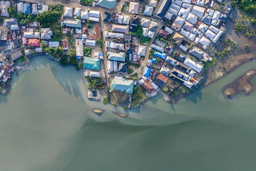 Port Harcourt Rivers Nigeria 03 July 2026 Aerial view of the coastal urban landscape in Port Harcourt featuring dense residential housing metal rooftops and the riverbank. Port Harcourt Rivers Nigeria 03 July 2026 Aerial view of the coastal urban landscape in Port Harcourt featuring dense residential housing metal rooftops and the riverbank.