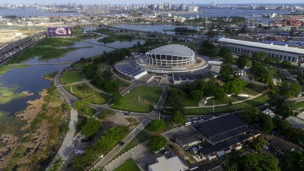 Aerial view of the Wole Soyinka Centre for Culture and Creative Arts National Theatre Nigeria surrounded by green lawns and urban infrastructure Lagos Lagos Nigeria. Aerial view of the Wole Soyinka Centre for Culture and Creative Arts National Theatre Nigeria surrounded by green lawns and urban infrastructure Lagos Lagos Nigeria.
