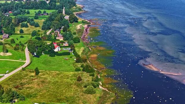 Aerial view of the green coastline and sea in Latvia. Aerial view of the green coastline and sea in Latvia.