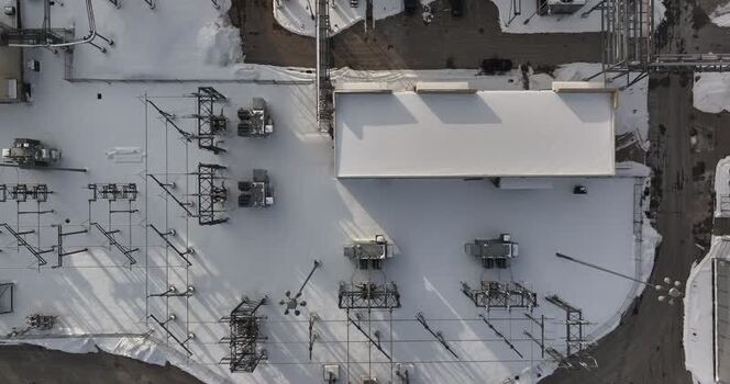 Aerial view of a snow covered electrical substation United States. Aerial view of a snow covered electrical substation United States.