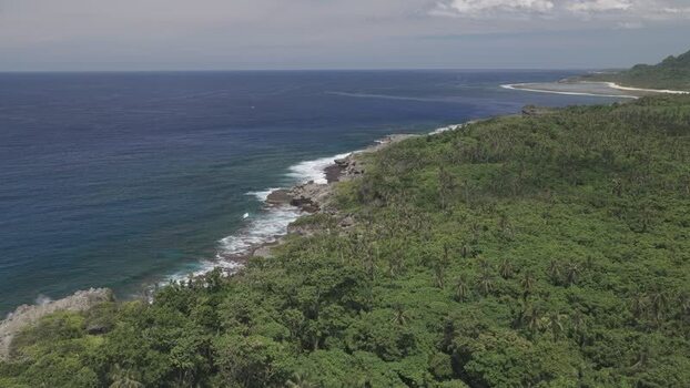 Aerial view of the lush tropical coastline of Siargao Philippines.