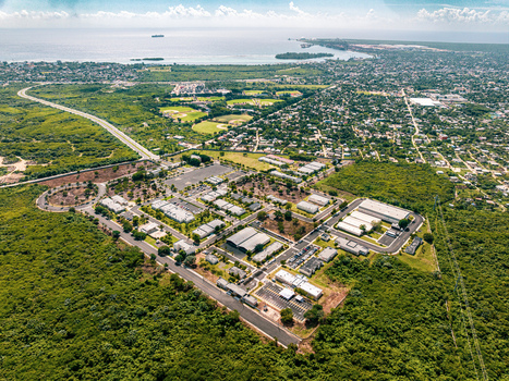 Aerial view of the Base de Infanteria de Marina Valm. Manuel Ramon Montes Arache surrounded by lush vegetation and urban infrastructure in Boca Chica Santo Domingo Dominican Republic. Aerial view of the Base de Infanteria de Marina Valm. Manuel Ramon Montes Arache surrounded by lush vegetation and urban infrastructure in Boca Chica Santo Domingo Dominican Republic.