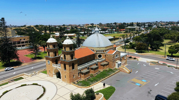 Aerial view of St Francis Xavier s Cathedral with its distinctive dome and twin towers surrounded by a paved plaza and urban landscape in Geraldton Western Australia Australia. Aerial view of St Francis Xavier s Cathedral with its distinctive dome and twin towers surrounded by a paved plaza and urban landscape in Geraldton Western Australia Australia.