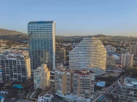 Aerial view of modern high rise apartment buildings and residential architecture in the coastal city of Calp Valencian Community Spain. Aerial view of modern high rise apartment buildings and residential architecture in the coastal city of Calp Valencian Community Spain.