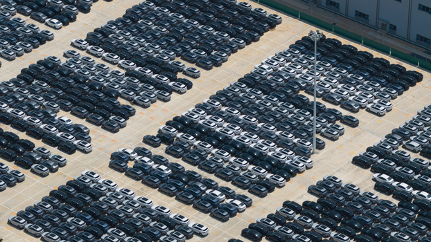 Aerial view of hundreds of new electric vehicles parked in neat rows at the BYD Thailand Rayong Office Building in Phananikhom Rayong Thailand. Aerial view of hundreds of new electric vehicles parked in neat rows at the BYD Thailand Rayong Office Building in Phananikhom Rayong Thailand.