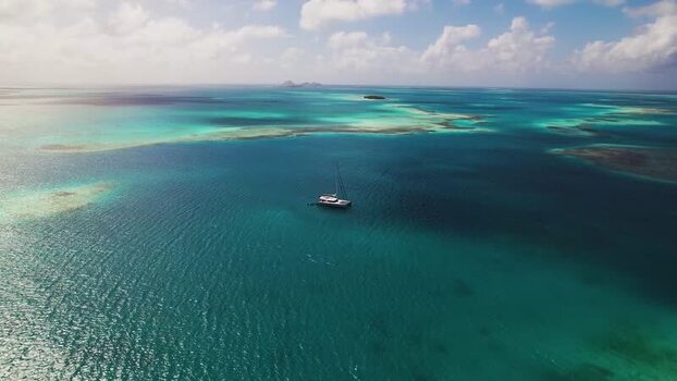 Aerial view of a sailboat in Los Roques archipelago Venezuela.