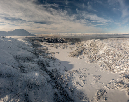 Aerial view of Gaustablikk Fjellresort nestled in the snow covered mountains and frozen landscape near Rjukan Telemark Norway. Aerial view of Gaustablikk Fjellresort nestled in the snow covered mountains and frozen landscape near Rjukan Telemark Norway.