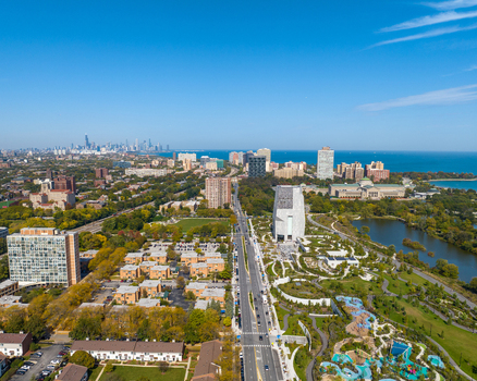 Aerial view of The Obama Presidential Center surrounded by lush parkland residential buildings and the Chicago skyline along Lake Michigan in Chicago Illinois United States. Aerial view of The Obama Presidential Center surrounded by lush parkland residential buildings and the Chicago skyline along Lake Michigan in Chicago Illinois United States.