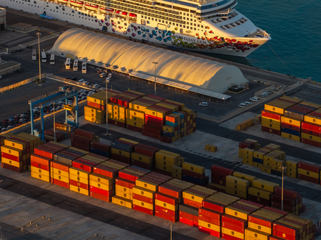 Civitavecchia Lazio Italy 23 August 2026 Aerial view of Civitavecchia Port featuring rows of colorful stacked shipping containers and a large cruise ship docked.