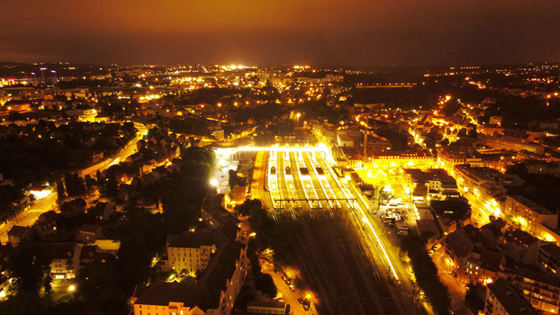 Aerial view of the illuminated railway station and surrounding urban landscape at night in Pontoise Ile de France France. Aerial view of the illuminated railway station and surrounding urban landscape at night in Pontoise Ile de France France.