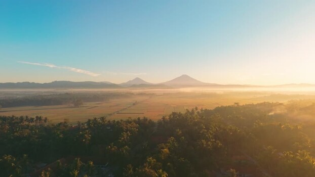 Aerial view of rice fields and mountains at sunrise Indonesia. Aerial view of rice fields and mountains at sunrise Indonesia.