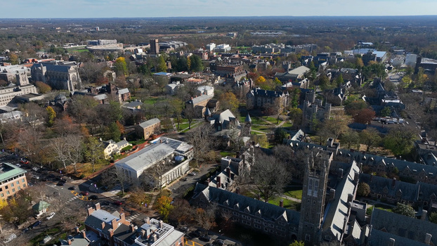 Aerial view of the Princeton University campus featuring historic gothic architecture stone buildings lush trees and winding pathways in Princeton New Jersey United States.