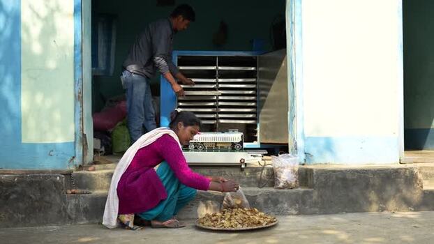 View of workers processing dried food in Dhangadhi Nepal. View of workers processing dried food in Dhangadhi Nepal.