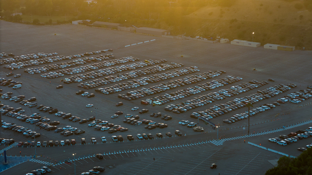 Aerial view of rows of cars filling the vast parking lot near 1000 Vin Scully Ave under a soft golden sunset Los Angeles California United States. Aerial view of rows of cars filling the vast parking lot near 1000 Vin Scully Ave under a soft golden sunset Los Angeles California United States.