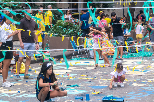 Rio de Janeiro Brazil 13 June 2026 View of children and adults decorating a street and painting the asphalt with Brazilian colors for the World Cup 2026.