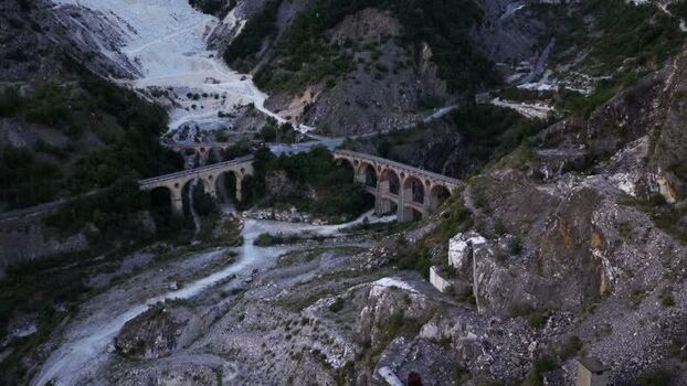 Aerial view of marble quarries and stone bridge in Carrara Italy. Aerial view of marble quarries and stone bridge in Carrara Italy.