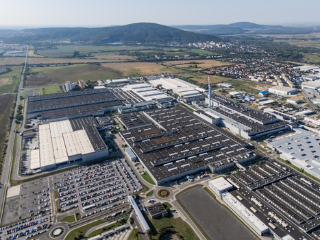 Aerial view of the Volkswagen plant near Devinska Nova Ves with industrial buildings and parking lots surrounded by green fields and hills in Bratislava Bratislavsky kraj Slovakia. Aerial view of the Volkswagen plant near Devinska Nova Ves with industrial buildings and parking lots surrounded by green fields and hills in Bratislava Bratislavsky kraj Slovakia.