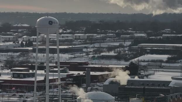 Aerial view of the GE Aerospace water tower and industrial area United States. Aerial view of the GE Aerospace water tower and industrial area United States.
