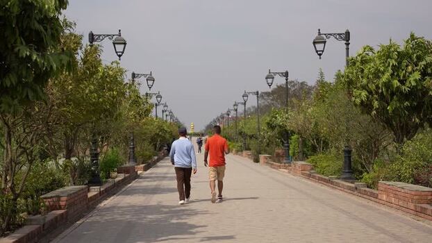View of people walking on a path in Lumbini Nepal.