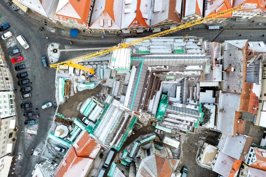 Aerial view of Rathaus Forchheim under renovation with a yellow crane scaffolding and snow dusted rooftops in the historic old town Forchheim Bayern Germany. Aerial view of Rathaus Forchheim under renovation with a yellow crane scaffolding and snow dusted rooftops in the historic old town Forchheim Bayern Germany.