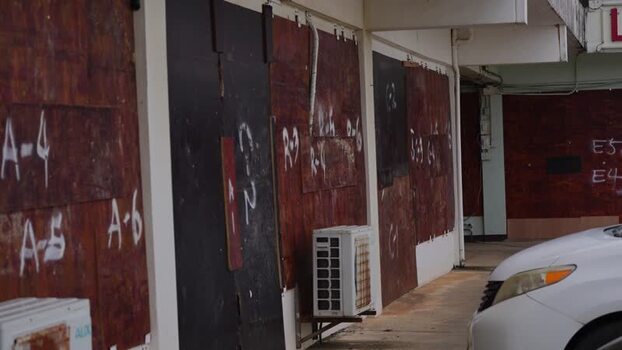 View of boarded up storefronts in San Jose Northern Mariana Islands. View of boarded up storefronts in San Jose Northern Mariana Islands.